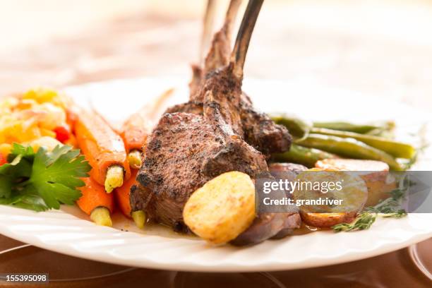 rack of lamb with carrots and green beans - easter lamb stock pictures, royalty-free photos & images