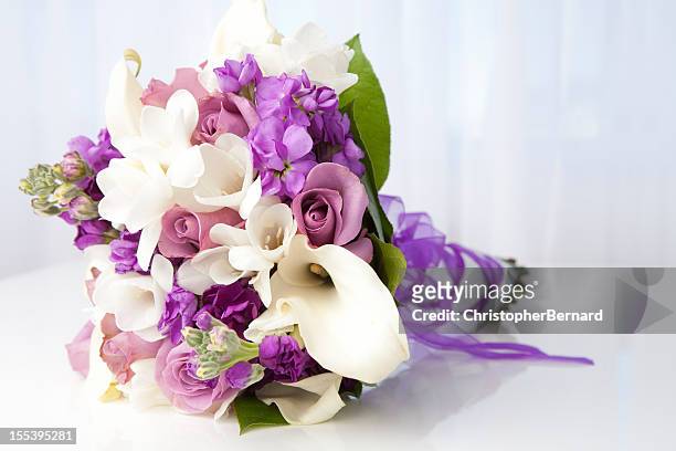 purple and white bridal bouquet - flower arrangement stock pictures, royalty-free photos & images
