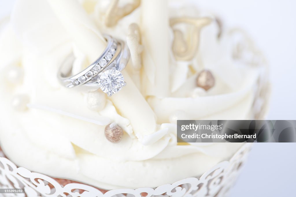 Engagement ring in wedding cupcake