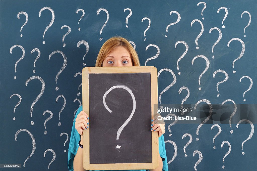 Woman Showing Question Mark on Blackboard