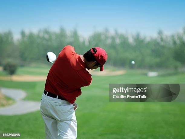 golf player powerful teeing off - xlarge - golf driver stock pictures, royalty-free photos & images