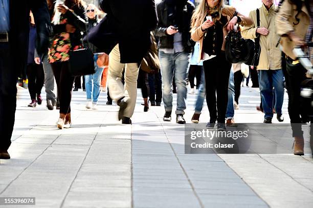 long time exposure of pedestrians - busy sidewalk stock pictures, royalty-free photos & images