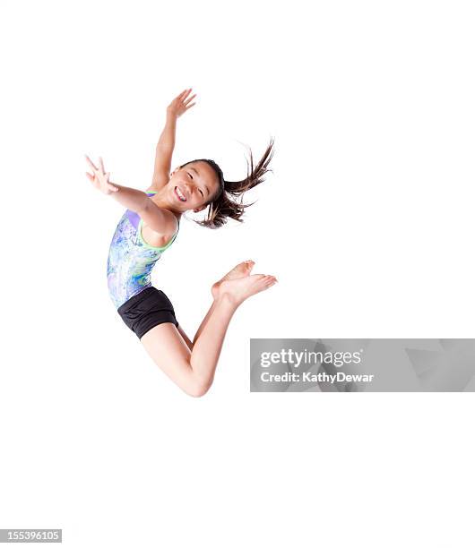 female child gymnast jumping in the air - gymnastic asian stockfoto's en -beelden