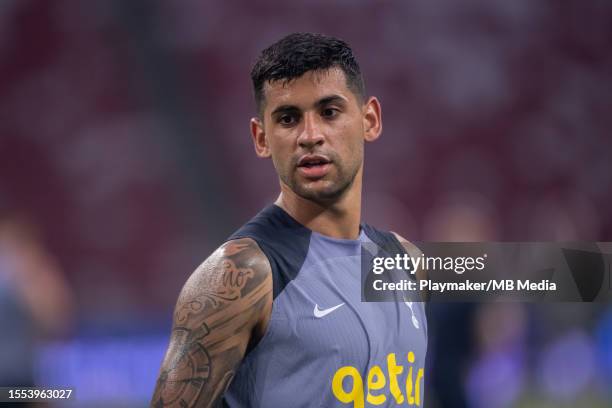 Cristian Romero of Tottenham Hotspur looks on at a training match during an open training session at the National Stadium on July 25, 2023 in...