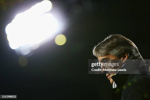 Roberto Mancini, manager of Manchester City looks on prior to the Barclays Premier League match between West Ham United and Manchester City at the...