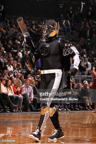 The Brooklyn Nets mascot Brookly Knight performs against the Toronto Raptors during the first ever regular home season game at the Barclays Center on...