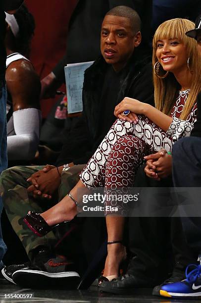 Jay-Z and wife Beyonce atttend the game between the Brooklyn Nets and the Toronto Raptors at the Barclays Center on November 3, 2012 in the Brooklyn...