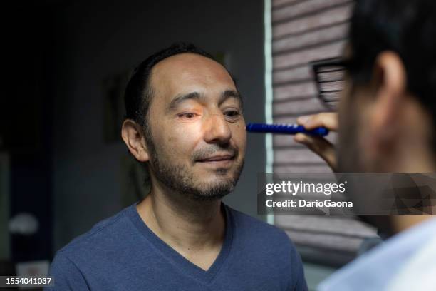 neurologist consulting with male patient - neurologist stock pictures, royalty-free photos & images