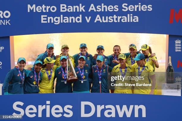 The Australia platers celebrate with the trophy after retaining the Ashes after the Women's Ashes 3rd We Got Game ODI match between England and...