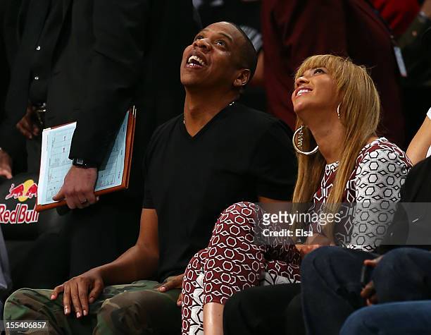 Jay-Z and wife Beyonce atttend the game between the Brooklyn Nets and the Toronto Raptors at the Barclays Center on November 3, 2012 in the Brooklyn...
