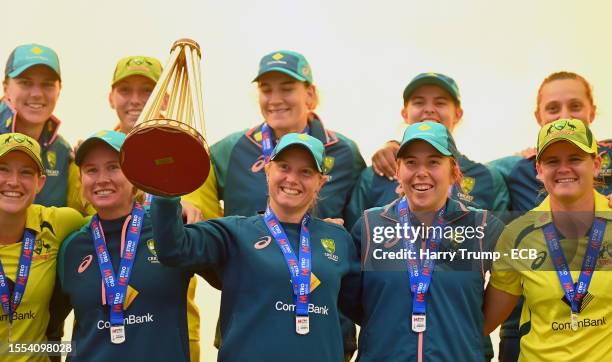 Alyssa Healy of Australia lifts the Women's Ashes Trophy alongside their team mates following the Women's Ashes 3rd We Got Game ODI match between...