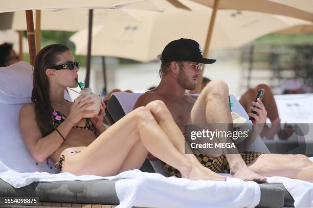 Nina Agdal and Logan Paul are seen taking a dip in the ocean while on vacation on July 22, 2023 in Miami Beach, Florida.