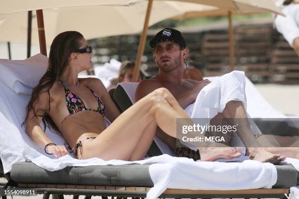 Nina Agdal and Logan Paul are seen taking a dip in the ocean while on vacation on July 22, 2023 in Miami Beach, Florida.