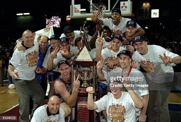 The Adelaide 36''ers with the Mitsubishi Challenge Trophy celebrate victory over the Victoria Titans, in Game 3 of the 1999 NBL Grand Final, at the...