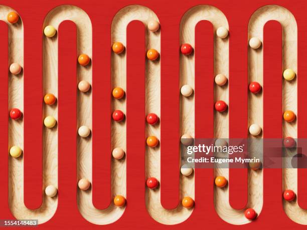 3d image of rolling spheres along a path. - zigzag path stock pictures, royalty-free photos & images
