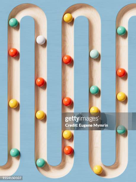 3d image of rolling spheres along a path. - zigzag path stock pictures, royalty-free photos & images