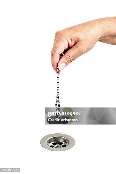 woman plugging hole, or sink drain - sink plug stock pictures, royalty-free photos & images