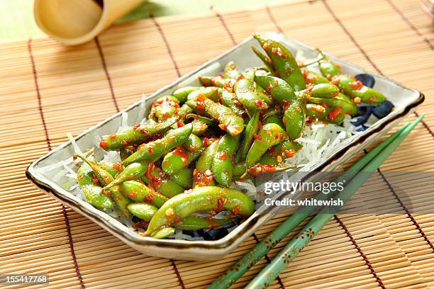 spicy garlic edamame - edamame stock pictures, royalty-free photos & images