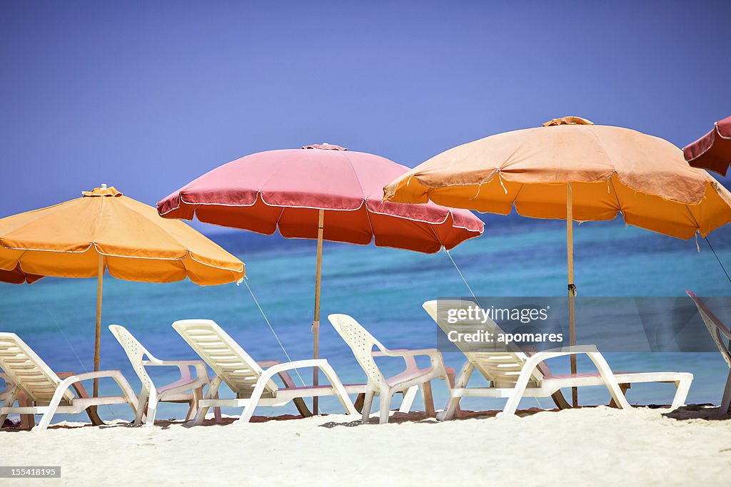 Umbrellas and lounge chairs on a Caribbean beach