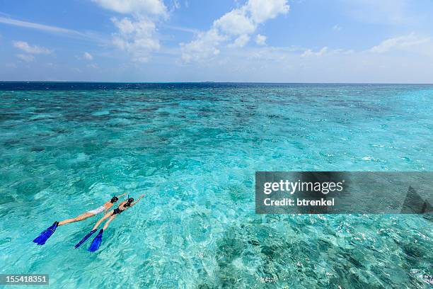 mom & daughter: snorkling during vacation - snorkel stock pictures, royalty-free photos & images