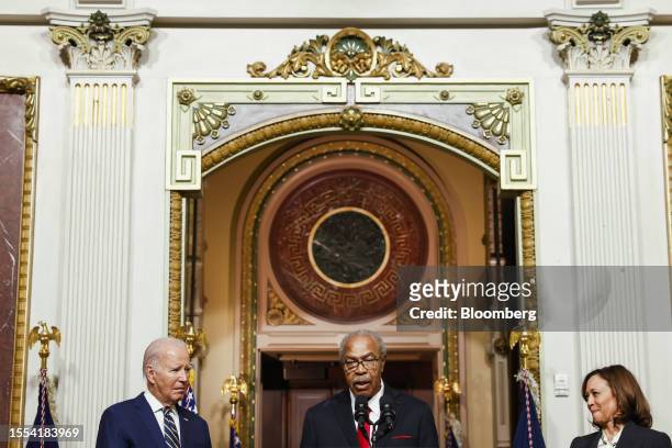 President Joe Biden, from left, Reverend Wheeler Parker Jr., a member of the Till Family, and US Vice President Kamala Harris before signing a...