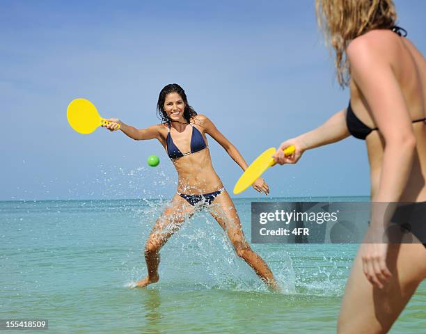 girls playing beach ball (xxxl) - racquet stock pictures, royalty-free photos & images