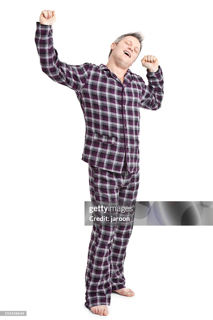 Happy young adult in pyjamas