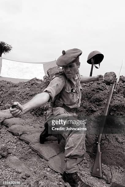 throwing a hand grenade. - trench stock pictures, royalty-free photos & images