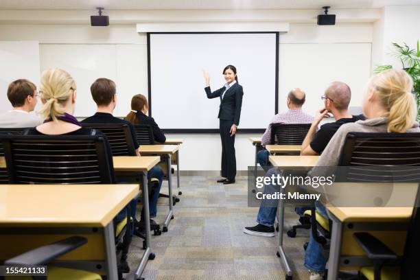 a japanese businesswoman teaching seminar to class - japan training session stock pictures, royalty-free photos & images