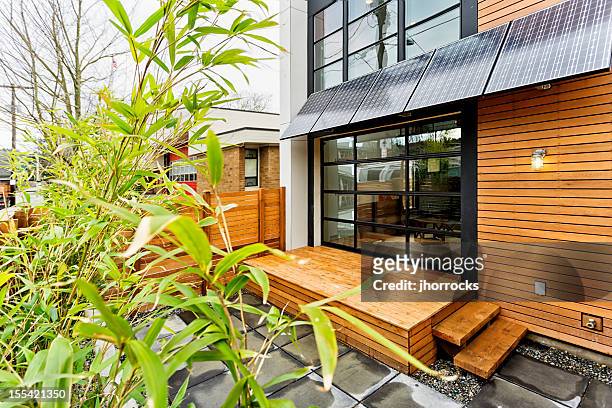 living green with solar panels - patio doors bildbanksfoton och bilder