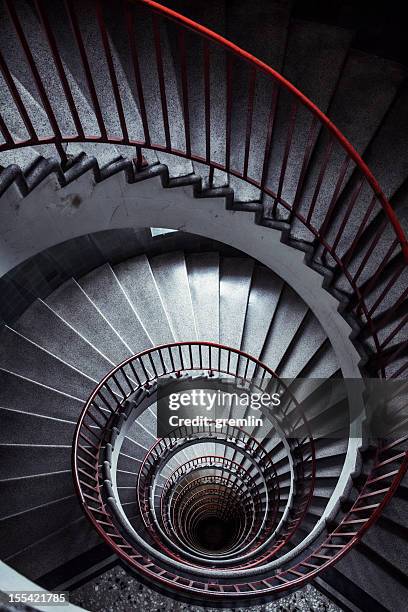 old spiral stairway from above - spiral staircase stock pictures, royalty-free photos & images