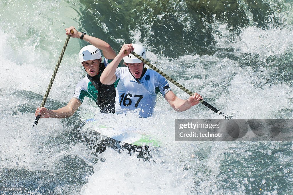 Canoe team in whitewater mist