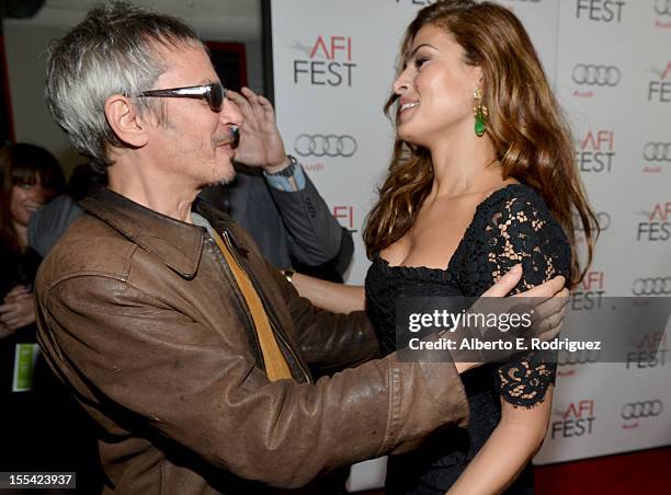 Director/Writer Leos Carax and actress Eva Mendes arrive at the "Holy Motors" special screening during the 2012 AFI Fest at Grauman's Chinese Theatre...