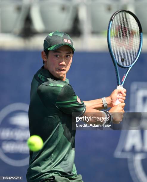 Kei Nishikori of Japan hits a shot against Jordan Thompson during the first round of the ATP Atlanta Open at Atlantic Station on July 25, 2023 in...