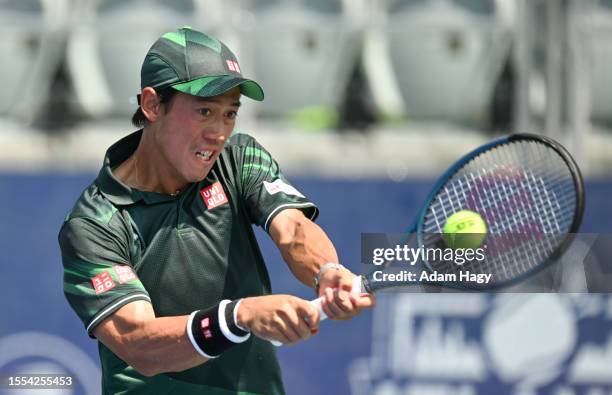 Kei Nishikori of Japan hits a shot against Jordan Thompson during the first round of the ATP Atlanta Open at Atlantic Station on July 25, 2023 in...