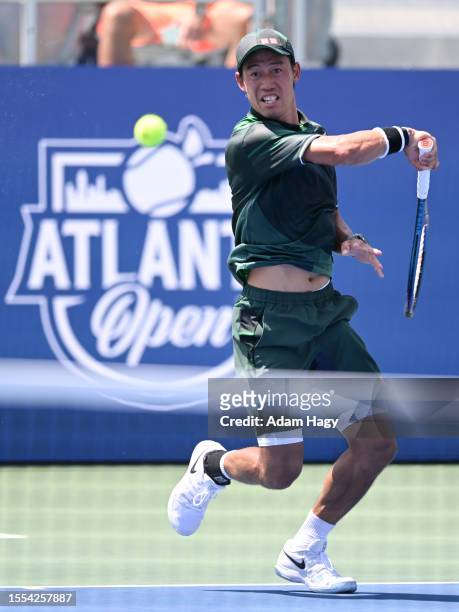 Kei Nishikori of Japan hits a shot against Jordan Thompson during the first round of the ATP Atlanta Open at Atlantic Station on July 25, 2023 in...