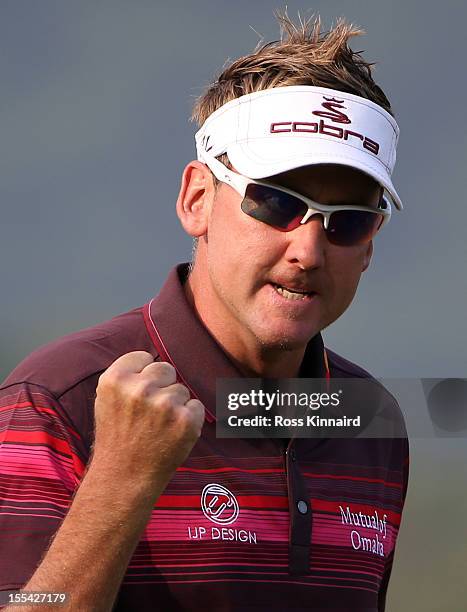 Ian Poulter of England celebrates on the 18th green after winning the WGC HSBC Champions during the final round at the Mission Hills Resort on...