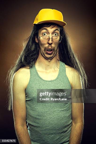 goofy redneck mit überrascht gesicht - hillbilly stock-fotos und bilder