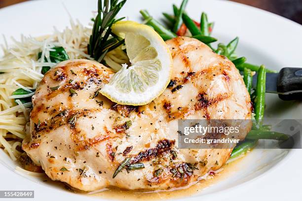 grilled chicken and pasta - lemon chicken stock pictures, royalty-free photos & images