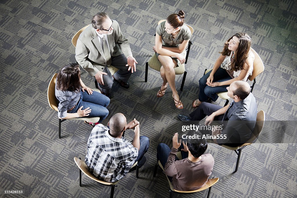 Aerial view of a diverse group sitting in a circle