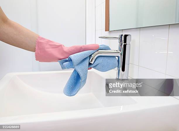 cleaning faucet - blue bathroom stock pictures, royalty-free photos & images