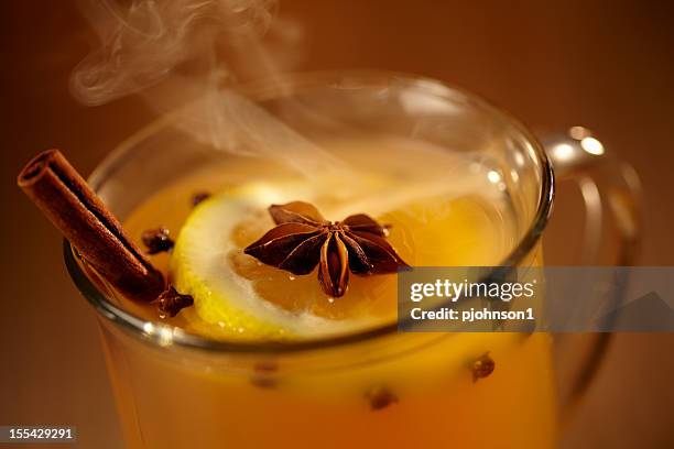 hot mulled cider - cloves stock pictures, royalty-free photos & images