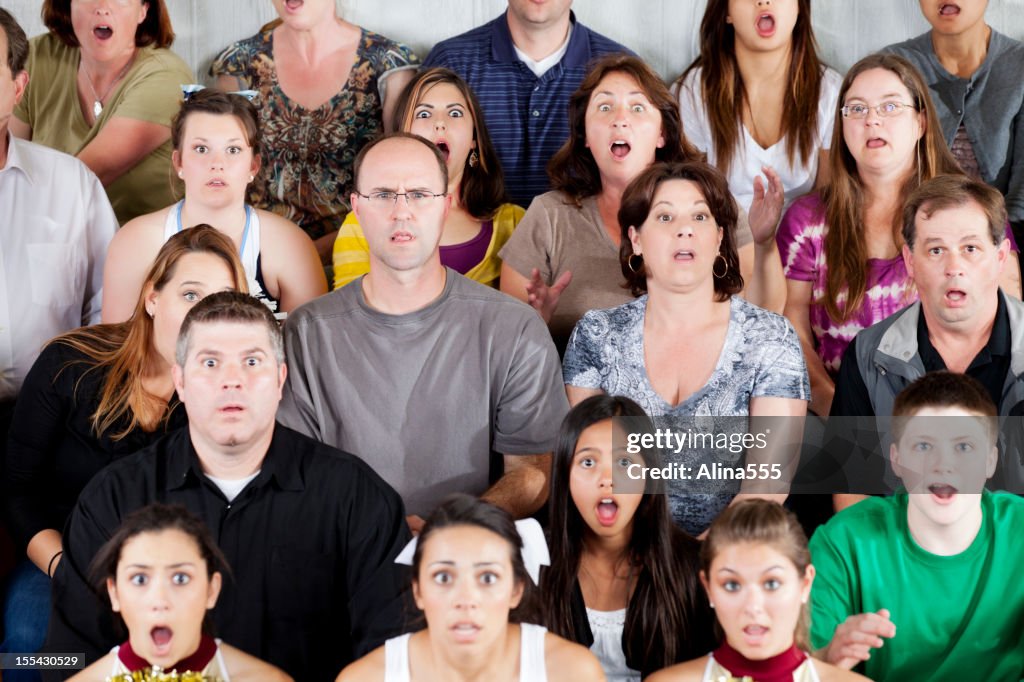 Large diverse group of people shocked at the game