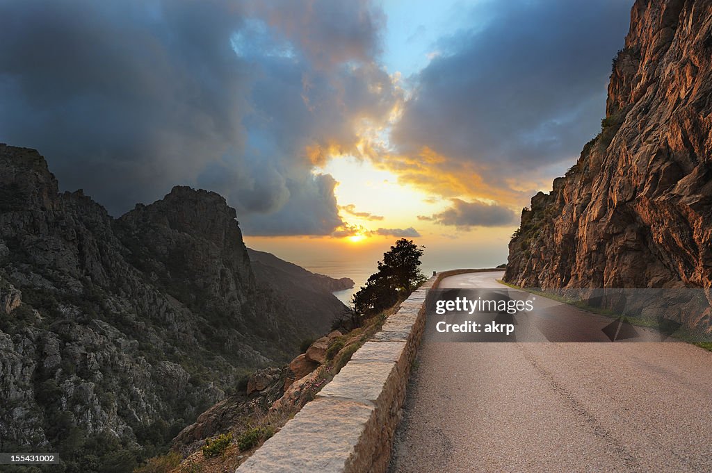 Coastal Road on the Island of Corsica at Sunset