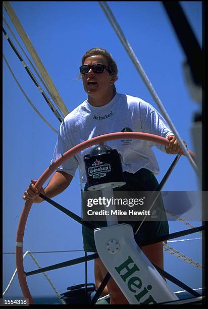 THE SKIPPER OF HEINEKEN DAWN RILEY IS SEEN AT THE HELM AS THE BOAT DEPARTS FORT LAUDERDALE, USA IN THE WHITBREAD ROUND THE WORLD YACHT RACE.