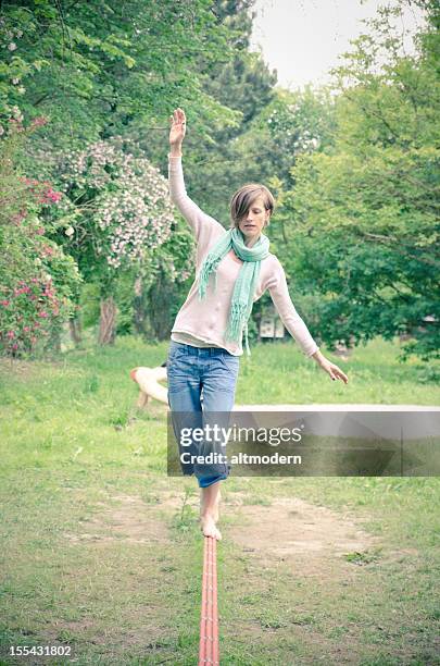 slackline - woman tightrope stock pictures, royalty-free photos & images