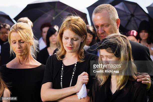 family at a funeral - mourning parent stock pictures, royalty-free photos & images