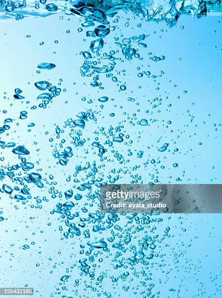 water bubbles - carbonated water stock pictures, royalty-free photos & images