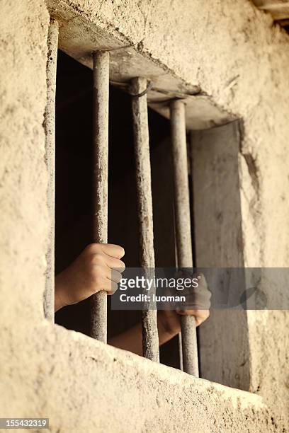 child in prison - prison window stock pictures, royalty-free photos & images