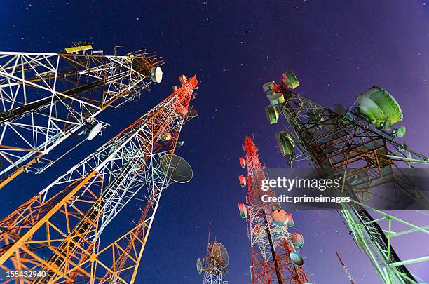 ground view of telecommunication towers - telecom tower stock pictures, royalty-free photos & images